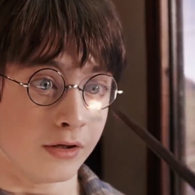 Hermione Granger casting Oculus Reparo on Harry Potter's glasses.